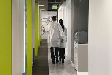 Dental Office Hallway & Equipment with Dentists Walking