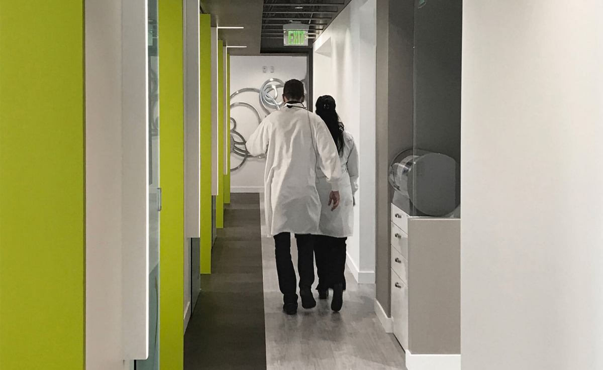 Dental Office Hallway & Equipment with Dentists Walking